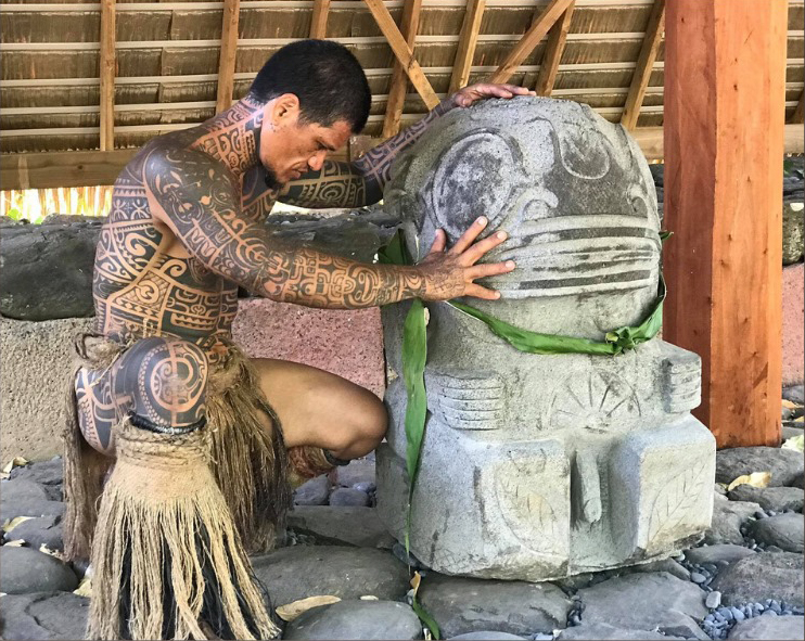 Marquisan Man praying on a stone Tiki