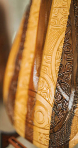 Focus on a engraved Polynesian Paddle